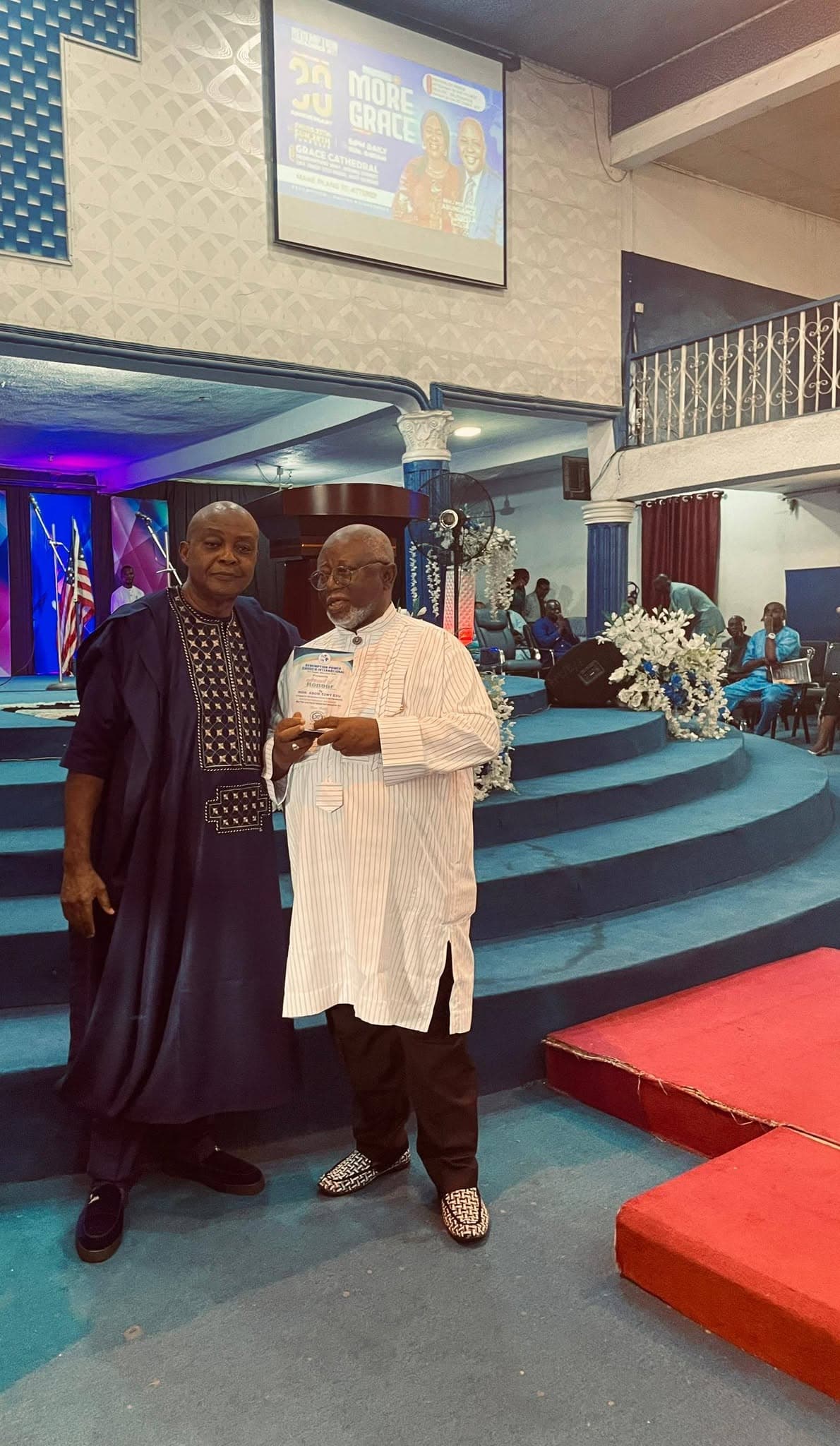 A couple standing together during the anniversary celebration
