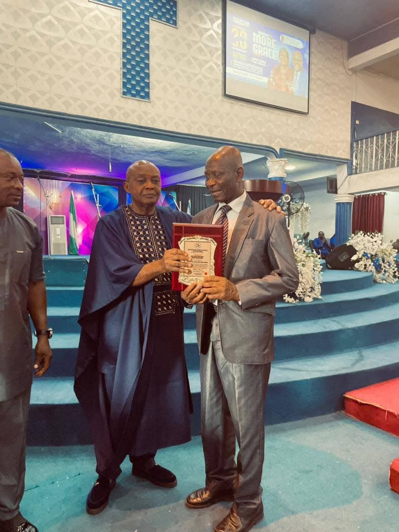 A member receiving an award at the 30th anniversary
